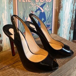 Christian Louboutin patent leather slingbacks.